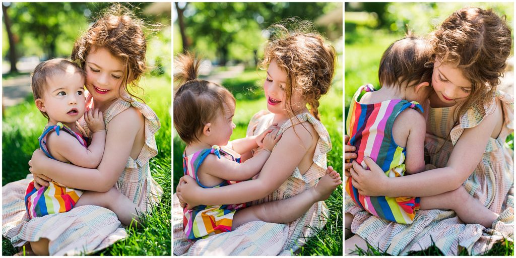 Two sisters hugging during a summer at-home St. Paul, Minnesota family photography session