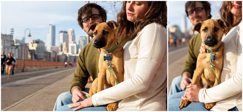 Couple hugging puppy on the Stone Arch Bridge during a Family Photography Session