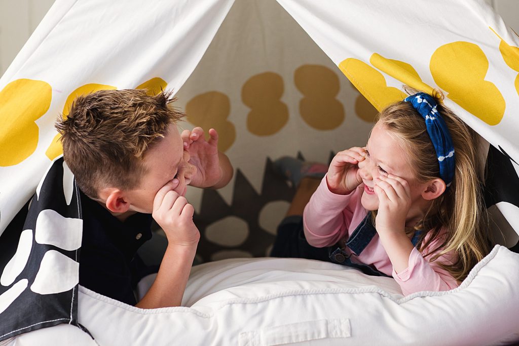Silly faces in a tent