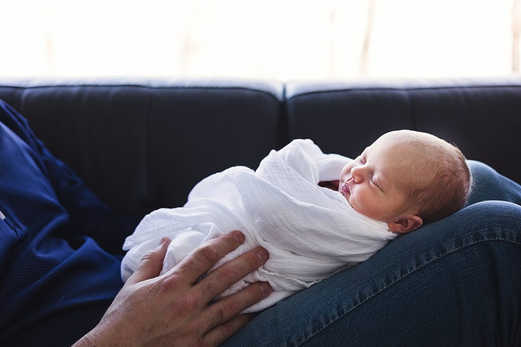 Edina Newborn Photographer - Dad's hands with baby