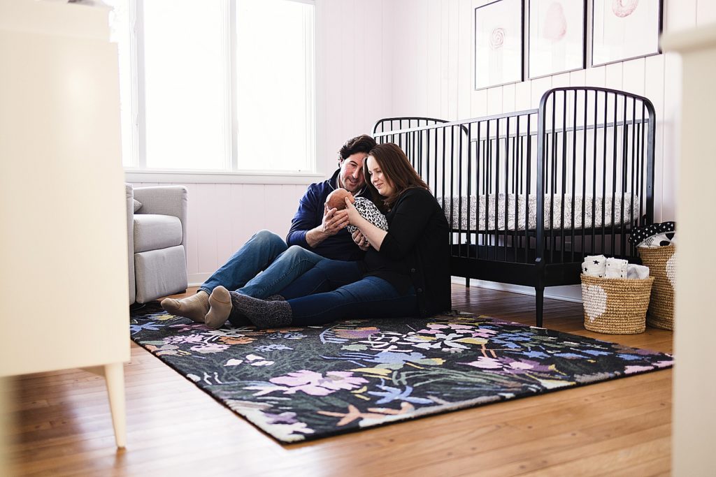Edina Newborn Photographer - Parents in nursery with baby