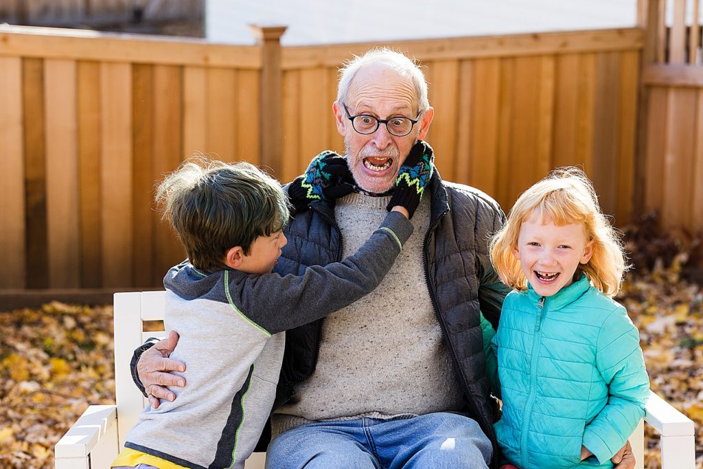 Minnesota Family Photographer captures grandpa and two kids in backyard
