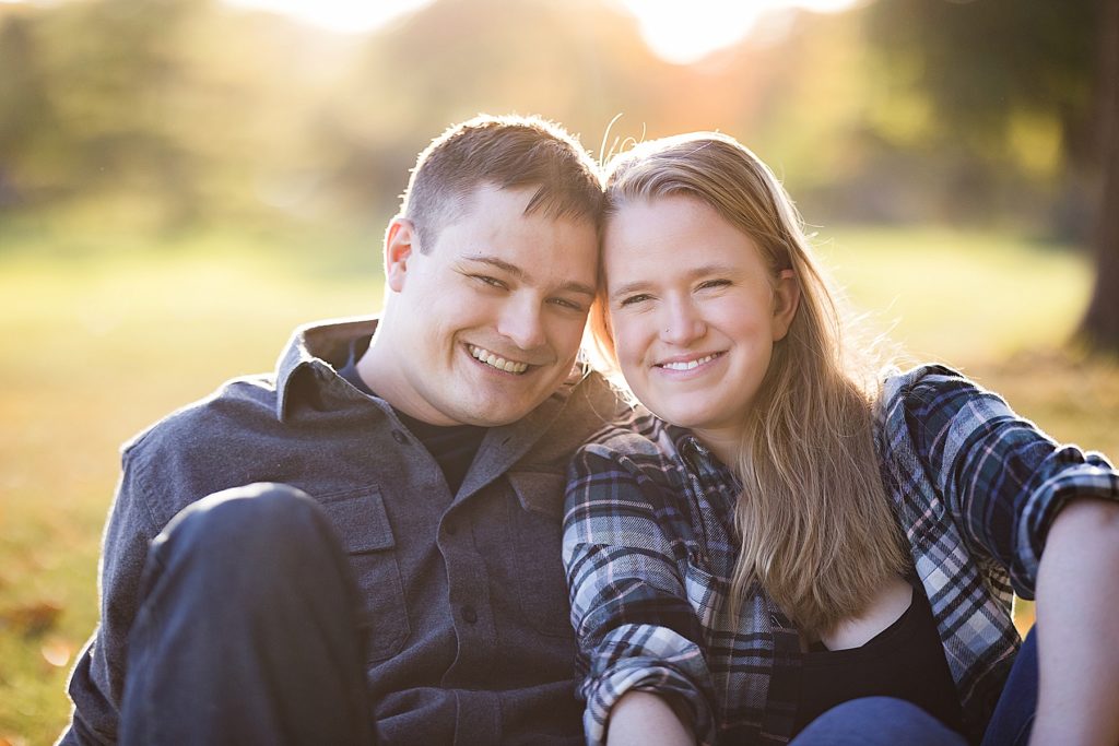 Lake Nokomis Engagement Photos - Couple looking and smiling