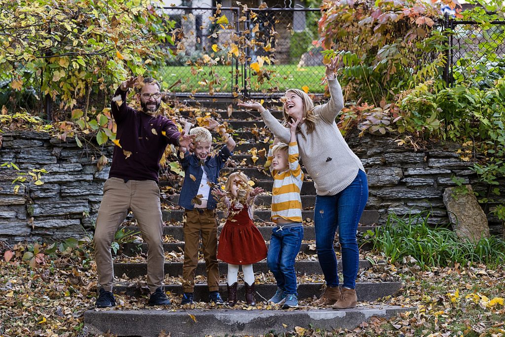 Minneapolis Fall Family Photos - Family throwing leaves