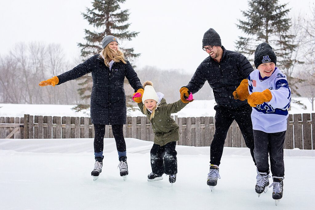 Family playing hockey for family photography in Minnetonka, MN during 5 fun ideas for family photos in winter
