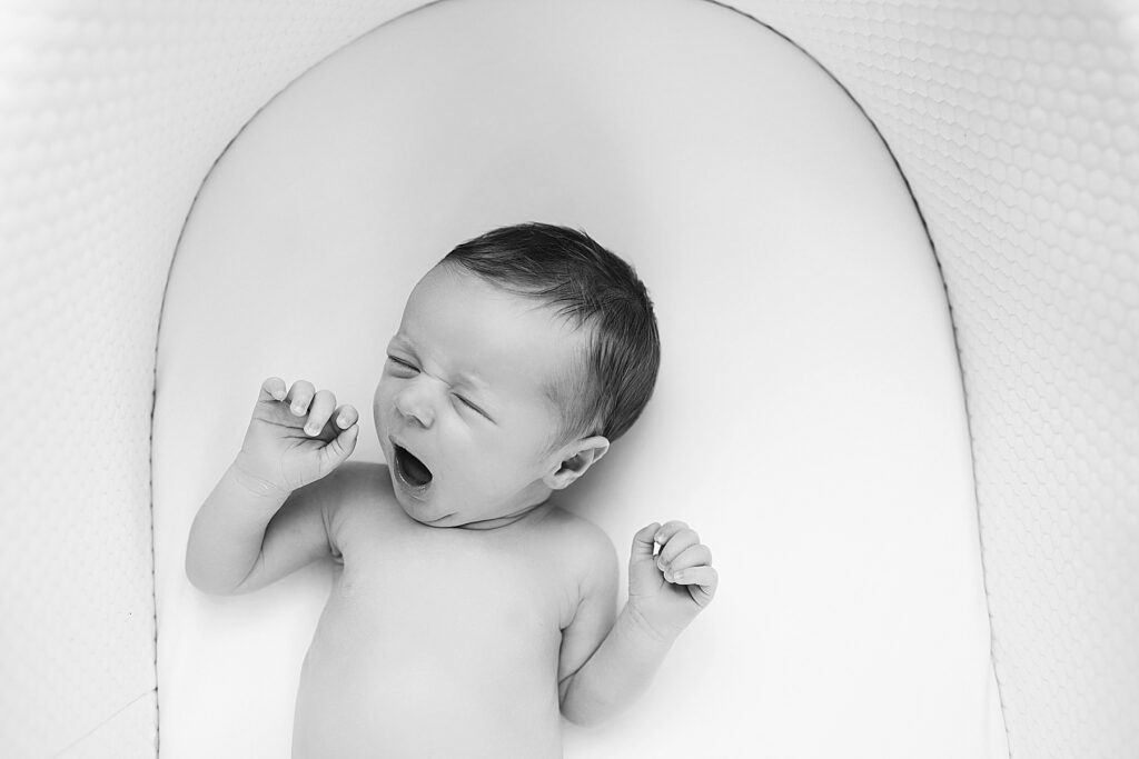 Newborn yawning at newborn session with Edina Photographer in The Best Edina Photographer for Maternity and Newborn Sessions.