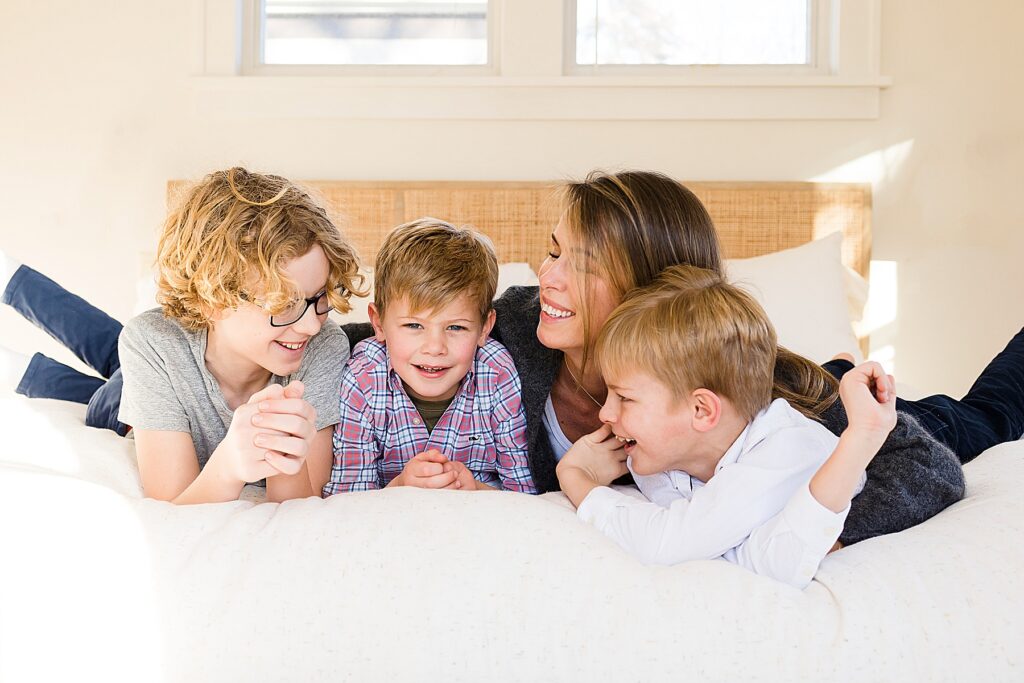 Family hug with three boys in 7 Huge Reasons to Book Your In-Home Family Photo Session.