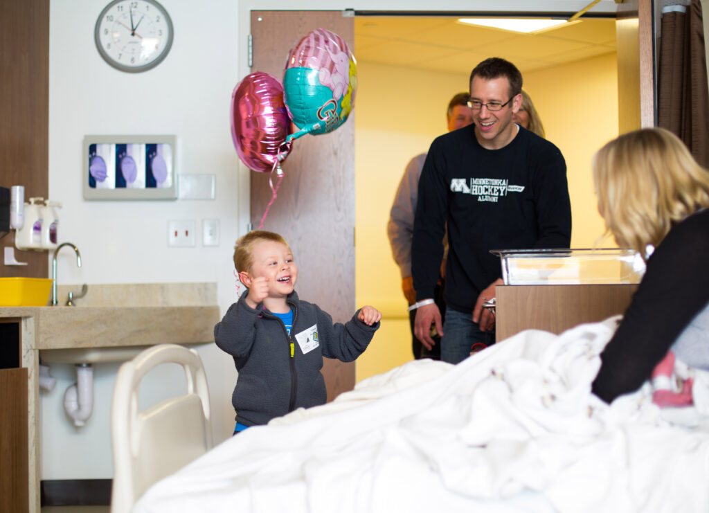 big brother meeting baby sibling for the first time during a fresh 48 session